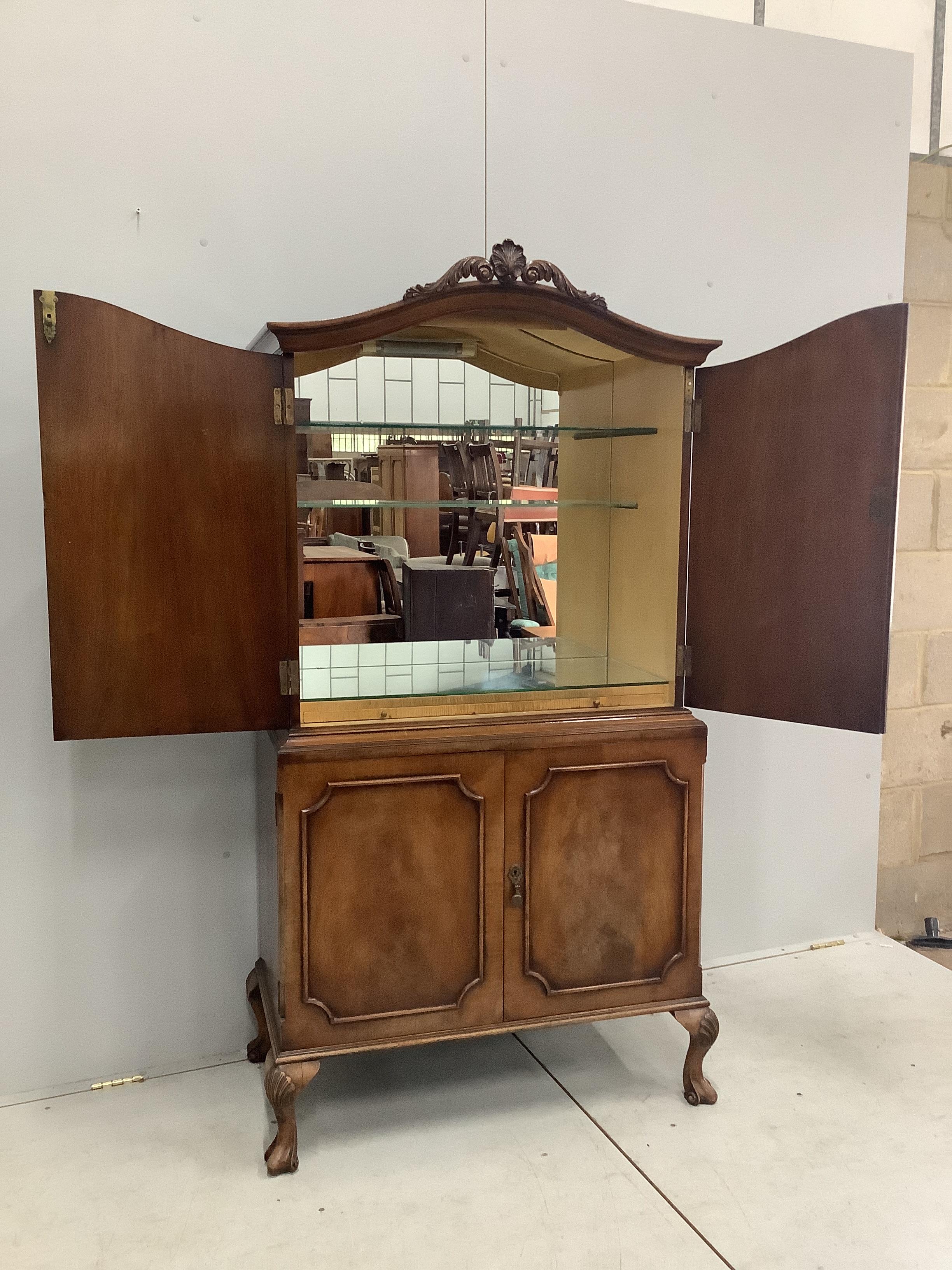 A Queen Anne style walnut cocktail cabinet, width 86cm, depth 44cm, height 171cm